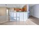 Spacious kitchen with wood cabinets, island, and ample counter space at 11240 Ragsdale Ct, New Port Richey, FL 34654