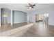 Living room with hardwood floors, access to patio, and bathroom at 11240 Ragsdale Ct, New Port Richey, FL 34654