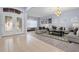 Open living room featuring hardwood floors and stylish furniture at 11240 Ragsdale Ct, New Port Richey, FL 34654
