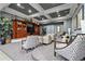 Elegant community lounge area with comfortable seating, a large entertainment center, and stylish decor at 11240 Ragsdale Ct, New Port Richey, FL 34654