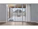 Screened patio with backyard view and sliding glass doors at 11240 Ragsdale Ct, New Port Richey, FL 34654