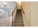 Elegant staircase leading to the upper level of the home at 11240 Ragsdale Ct, New Port Richey, FL 34654