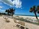 Beautiful ocean and beach view from a tiled patio with comfortable seating at 1390 Gulf Blvd # Ph-1, Clearwater Beach, FL 33767