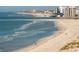 Panoramic view of beach with people and distant buildings at 1390 Gulf Blvd # Ph-1, Clearwater Beach, FL 33767