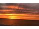 Breathtaking sunset over the ocean with fiery colors at 1390 Gulf Blvd # Ph-1, Clearwater Beach, FL 33767