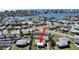 Aerial view showing a single-story home near the water at 14140 E Parsley Dr, Madeira Beach, FL 33708
