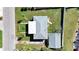 Overhead view of house, detached garage, and yard at 14140 E Parsley Dr, Madeira Beach, FL 33708