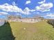 Backyard view showing a spacious grassy area at 14140 E Parsley Dr, Madeira Beach, FL 33708