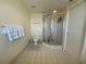 Clean bathroom with shower, toilet, and tiled flooring at 1540 Gulf Blvd # 2107, Clearwater Beach, FL 33767