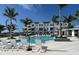 Resort-style pool with lounge chairs and umbrellas at 1582 Running Tide Pl, Sarasota, FL 34240