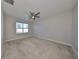 Spacious bedroom with ceiling fan and large window with natural light at 16425 Little Garden Dr, Wimauma, FL 33598