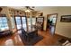 Bright dining room with hardwood floors and French doors leading outside at 2460 Richards Rd, Tarpon Springs, FL 34688