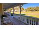 Long front porch with white railings and a view of the street at 2460 Richards Rd, Tarpon Springs, FL 34688