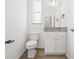 Modern bathroom with white cabinets, granite countertop, and a bathtub at 3005 E 17Th Ave, Tampa, FL 33605