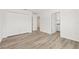 Well-lit bedroom with wood-look flooring and private bathroom access at 3005 E 17Th Ave, Tampa, FL 33605