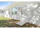 Home's exterior with a white door and window at 3005 E 17Th Ave, Tampa, FL 33605