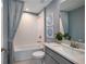Clean bathroom with a tub, gray walls, and modern vanity at 3234 Sunrise Spring Pl, Brandon, FL 33511