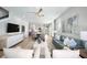 Bright living room features an open floor plan, hardwood floors, and a view into the kitchen at 3234 Sunrise Spring Pl, Brandon, FL 33511