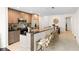 Modern kitchen with breakfast bar and stainless steel appliances at 331 Cleveland St # 602, Clearwater, FL 33755