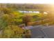 Aerial view highlighting the golf course and water views surrounding the property at 3401 Avenida Madera # B, Bradenton, FL 34210