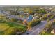 An aerial view of the home in a community with a golf course and water feature at 3401 Avenida Madera # B, Bradenton, FL 34210