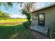 Home exterior with a view of the grassy backyard and adjacent golf course at 3401 Avenida Madera # B, Bradenton, FL 34210