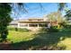 Exterior home view highlighting the lush lawn and well-maintained landscaping at 3401 Avenida Madera # B, Bradenton, FL 34210