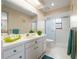 Bathroom with a white sink, a glassed in shower, white tiling, and a view of the bedroom at 3401 Avenida Madera # B, Bradenton, FL 34210