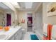 Bathroom featuring a double vanity, and shower-tub combination, with a bedroom view at 3401 Avenida Madera # B, Bradenton, FL 34210