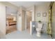 Well-lit bathroom with toilet, and vanity and access to a walk-in closet and the main bedroom at 3401 Avenida Madera # B, Bradenton, FL 34210