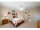 Spacious bedroom with queen bed, en-suite bathroom, and nautical decor at 3401 Avenida Madera # B, Bradenton, FL 34210