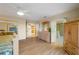 Large bedroom with wood floors, dresser, and open doorway leading to the bathroom at 3401 Avenida Madera # B, Bradenton, FL 34210