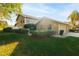Tan two-story villa with double garage and yard at 3401 Avenida Madera # B, Bradenton, FL 34210