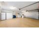 Spacious two car garage with epoxy flooring, cabinetry, sink, laundry, and a refrigerator at 3401 Avenida Madera # B, Bradenton, FL 34210