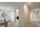 Hallway with carpet flooring and neutral walls; with access to a home office at 3401 Avenida Madera # B, Bradenton, FL 34210