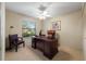 Home office with classic furniture, window view, and neutral paint at 3401 Avenida Madera # B, Bradenton, FL 34210