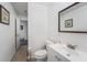 Simple bathroom with white vanity and toilet at 4609 Horton Rd, Plant City, FL 33567