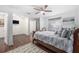 Large bedroom with hardwood floors and a ceiling fan at 4609 Horton Rd, Plant City, FL 33567