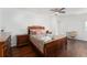 Cozy bedroom featuring wood floors and a ceiling fan at 4609 Horton Rd, Plant City, FL 33567