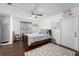 Bright bedroom with hardwood floors and ceiling fan at 4609 Horton Rd, Plant City, FL 33567