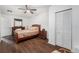 Well-lit bedroom with wood floors and a large closet at 4609 Horton Rd, Plant City, FL 33567