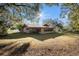 Ranch-style home with brick exterior, situated on a spacious lot with mature trees at 4609 Horton Rd, Plant City, FL 33567