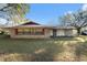 Ranch-style home with brick facade and spacious yard at 4609 Horton Rd, Plant City, FL 33567