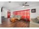 Bright and airy living room, featuring hardwood floors and a ceiling fan at 4609 Horton Rd, Plant City, FL 33567
