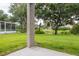 Inviting backyard with lush lawn and serene water view at 5733 Heronpark Pl, Lithia, FL 33547