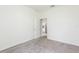 This bedroom features neutral walls and carpet, offering a calming space at 5733 Heronpark Pl, Lithia, FL 33547