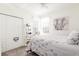 Spacious bedroom with a large bed, closet, and plenty of natural light at 5733 Heronpark Pl, Lithia, FL 33547