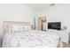 Comfortable bedroom with a queen-size bed and access to a small kitchen at 5733 Heronpark Pl, Lithia, FL 33547