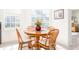 Cozy dining area with wood table and chairs, near kitchen at 5733 Heronpark Pl, Lithia, FL 33547