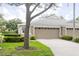 Well-maintained townhome featuring an attached two-car garage at 5733 Heronpark Pl, Lithia, FL 33547